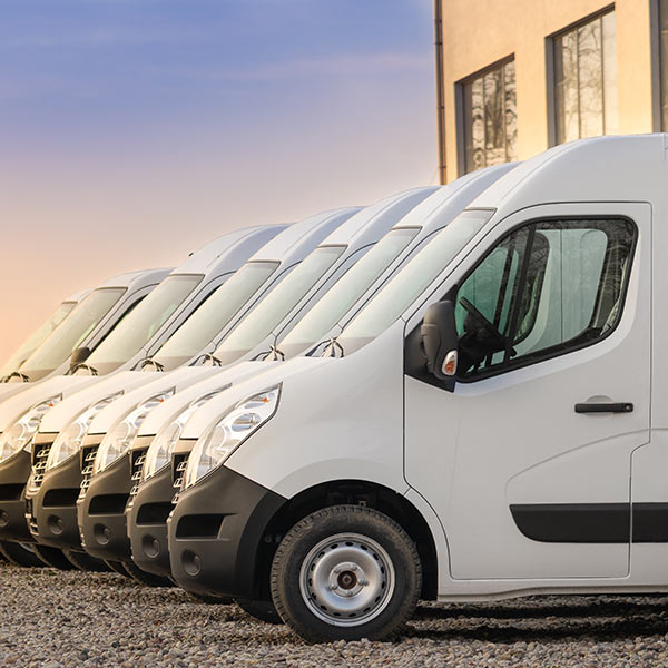 Large fleet of commercial delivery vans.